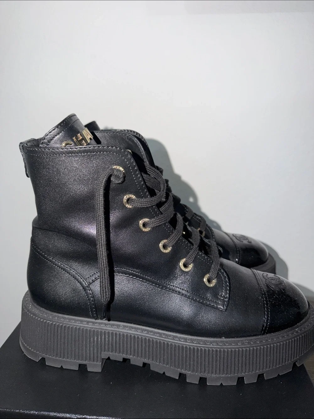 CHANEL Black High-Top Combat Boots with Gloss Toe Cap